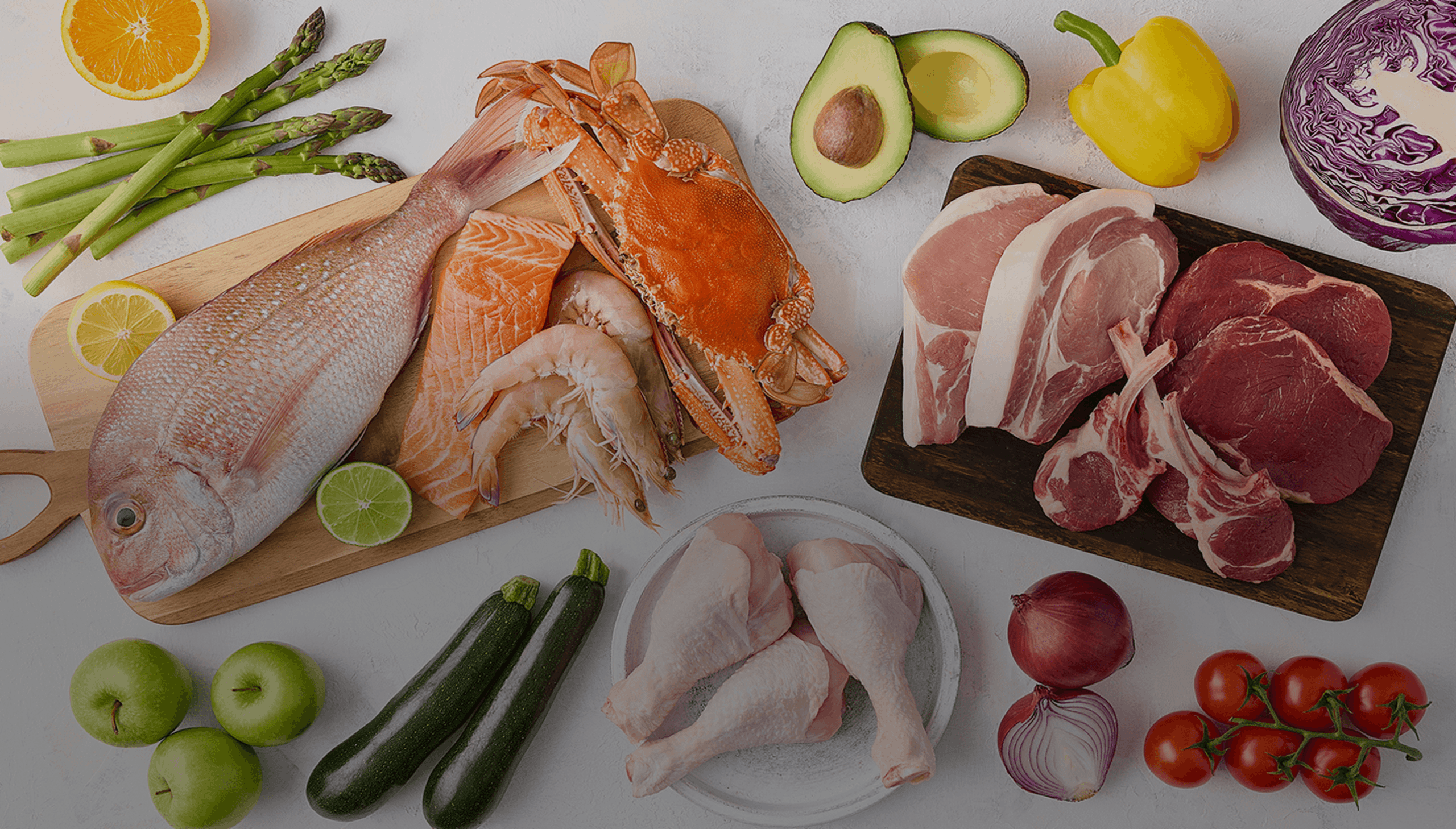 Variety of fresh foods: fish, crab, shrimp, meats, chicken, fruits, and vegetables.