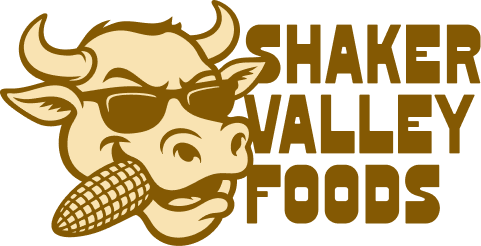 Shaker Valley Foods logo: Cartoon cow with sunglasses holding corn.