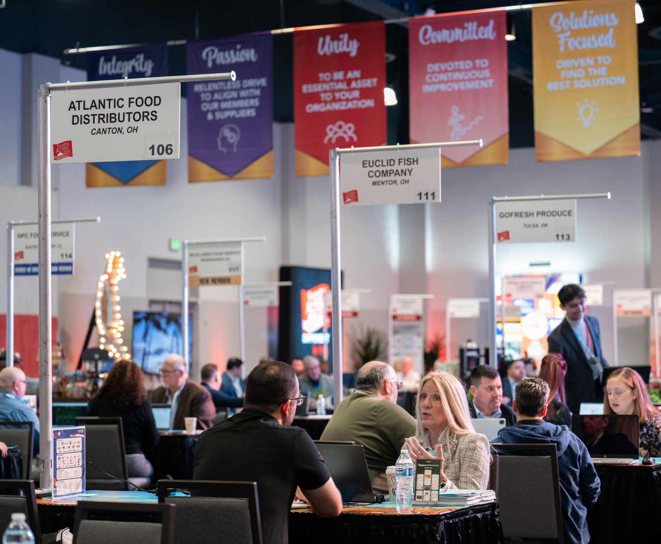 Trade show floor with booths from Atlantic Food Distributors and Euclid Fish Company.