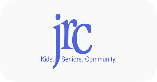 Logo of JRC, an organization focused on supporting kids, seniors, and community initiatives. The design features the letters "jrc" in a modern blue font, accompanied by the tagline "Kids. Seniors. Community." on a light background.