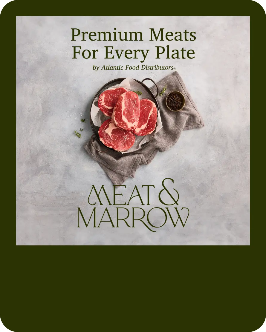 Image featuring a selection of raw meat cuts arranged on a plate, accompanied by a small bowl of spices, with a textured background. The text above highlights "Protein Solutions for Real-World Kitchens" by Atlantic Food Distributors, emphasizing the focus on high-quality protein options for culinary use.